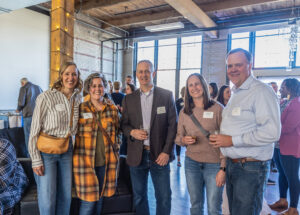 People posed together and smiling. 