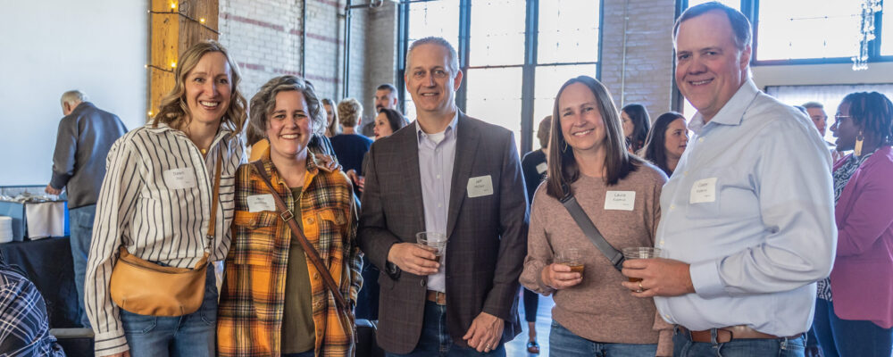 People posed together and smiling.